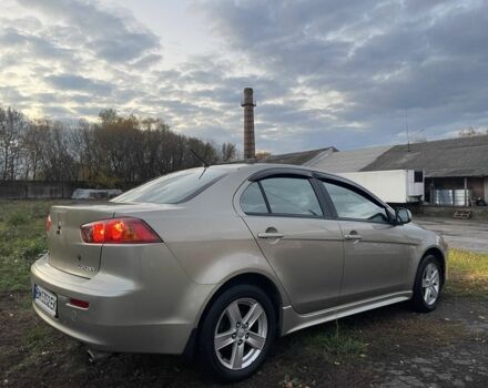 Бежевый Мицубиси Лансер Эволюшн, объемом двигателя 2 л и пробегом 155 тыс. км за 6950 $, фото 6 на Automoto.ua