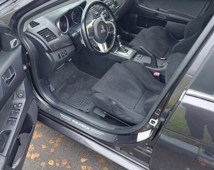 Черный Мицубиси Лансер Эволюшн, объемом двигателя 2 л и пробегом 116 тыс. км за 16900 $, фото 12 на Automoto.ua