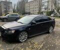 Чорний Міцубісі Лансер Еволюшн, об'ємом двигуна 2 л та пробігом 180 тис. км за 5506 $, фото 1 на Automoto.ua