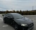 Чорний Міцубісі Лансер Еволюшн, об'ємом двигуна 2 л та пробігом 157 тис. км за 21000 $, фото 1 на Automoto.ua