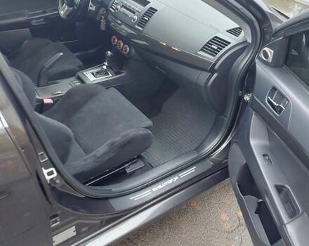 Черный Мицубиси Лансер Эволюшн, объемом двигателя 2 л и пробегом 116 тыс. км за 16900 $, фото 8 на Automoto.ua