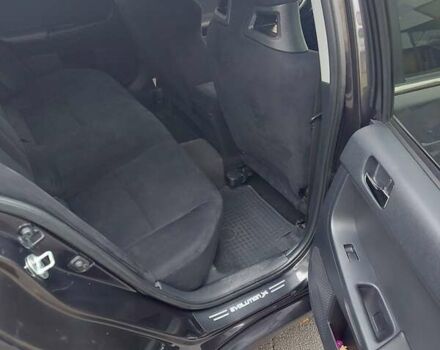 Черный Мицубиси Лансер Эволюшн, объемом двигателя 2 л и пробегом 116 тыс. км за 16900 $, фото 9 на Automoto.ua