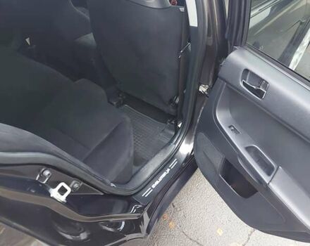 Черный Мицубиси Лансер Эволюшн, объемом двигателя 2 л и пробегом 116 тыс. км за 16900 $, фото 7 на Automoto.ua