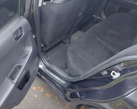 Черный Мицубиси Лансер Эволюшн, объемом двигателя 2 л и пробегом 116 тыс. км за 16900 $, фото 16 на Automoto.ua