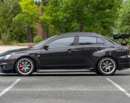 Черный Мицубиси Лансер Эволюшн, объемом двигателя 2 л и пробегом 90 тыс. км за 6400 $, фото 4 на Automoto.ua