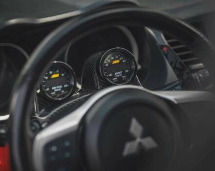 Черный Мицубиси Лансер Эволюшн, объемом двигателя 2 л и пробегом 90 тыс. км за 6400 $, фото 5 на Automoto.ua