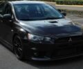 Черный Мицубиси Лансер Эволюшн, объемом двигателя 2 л и пробегом 88 тыс. км за 6400 $, фото 1 на Automoto.ua