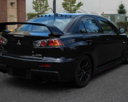 Черный Мицубиси Лансер Эволюшн, объемом двигателя 2 л и пробегом 88 тыс. км за 6400 $, фото 5 на Automoto.ua