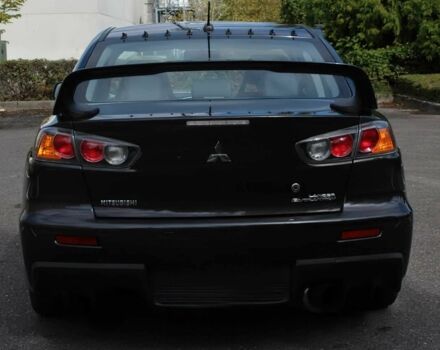 Чорний Міцубісі Лансер Еволюшн, об'ємом двигуна 2 л та пробігом 85 тис. км за 6400 $, фото 4 на Automoto.ua