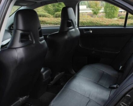 Черный Мицубиси Лансер Эволюшн, объемом двигателя 2 л и пробегом 88 тыс. км за 6400 $, фото 11 на Automoto.ua