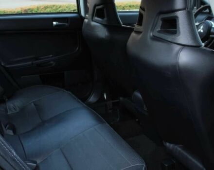 Черный Мицубиси Лансер Эволюшн, объемом двигателя 2 л и пробегом 88 тыс. км за 6400 $, фото 9 на Automoto.ua