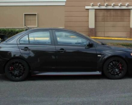 Черный Мицубиси Лансер Эволюшн, объемом двигателя 2 л и пробегом 88 тыс. км за 6400 $, фото 6 на Automoto.ua