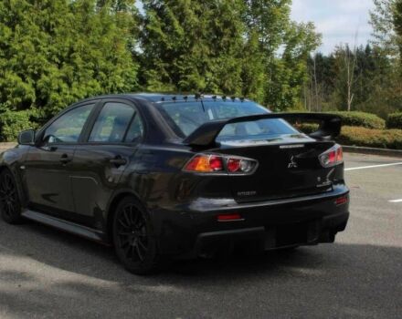 Черный Мицубиси Лансер Эволюшн, объемом двигателя 2 л и пробегом 88 тыс. км за 6400 $, фото 4 на Automoto.ua