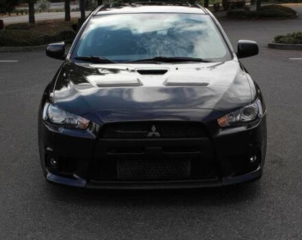 Черный Мицубиси Лансер Эволюшн, объемом двигателя 2 л и пробегом 88 тыс. км за 6400 $, фото 1 на Automoto.ua