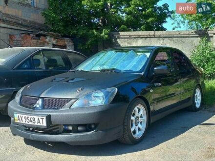 Міцубісі Лансер Еволюшн 2006 у Полтаві на Automoto.ua Чорний Міцубісі Лансер Еволюшн, об'ємом двигуна 2 л та пробігом 140 тис. км за 8000 $, фото 1 на Automoto.ua