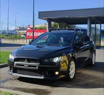Черный Мицубиси Лансер Эволюшн, объемом двигателя 2 л и пробегом 134 тыс. км за 26737 $, фото 1 на Automoto.ua