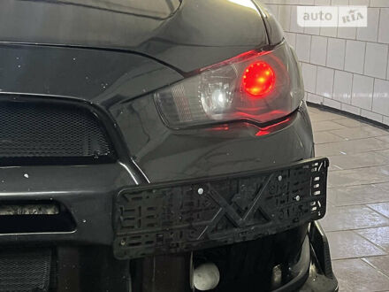 Міцубісі Лансер Еволюшн 2008 у Полтаві на Automoto.ua Чорний Міцубісі Лансер Еволюшн, об'ємом двигуна 2 л та пробігом 124 тис. км за 16500 $, фото 1 на Automoto.ua
