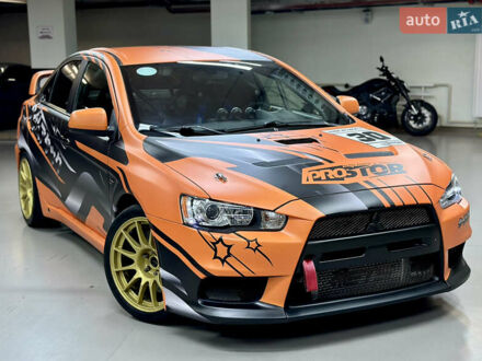 Міцубісі Лансер Еволюшн 2008 у Києві на Automoto.ua Чорний Міцубісі Лансер Еволюшн, об'ємом двигуна 2 л та пробігом 93 тис. км за 49900 $, фото 1 на Automoto.ua