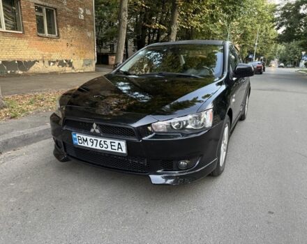Черный Мицубиси Лансер Эволюшн, объемом двигателя 2 л и пробегом 202 тыс. км за 5700 $, фото 1 на Automoto.ua