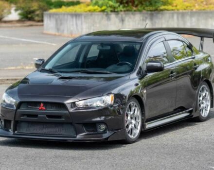 Чорний Міцубісі Лансер Еволюшн, об'ємом двигуна 2 л та пробігом 90 тис. км за 6400 $, фото 1 на Automoto.ua