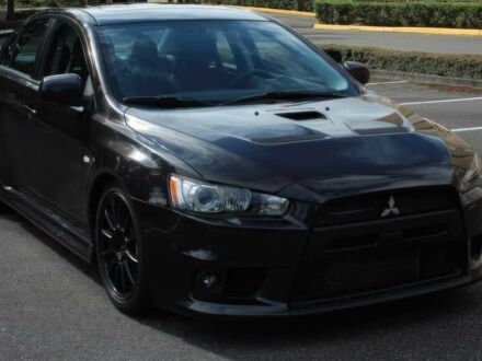 Черный Мицубиси Лансер Эволюшн, объемом двигателя 2 л и пробегом 88 тыс. км за 6400 $, фото 1 на Automoto.ua