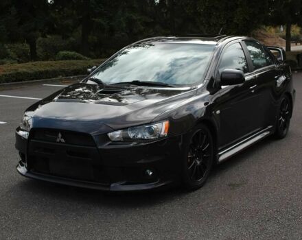 Чорний Міцубісі Лансер Еволюшн, об'ємом двигуна 2 л та пробігом 85 тис. км за 6400 $, фото 1 на Automoto.ua