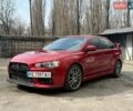 Красный Мицубиси Лансер Эволюшн, объемом двигателя 2 л и пробегом 105 тыс. км за 16700 $, фото 1 на Automoto.ua