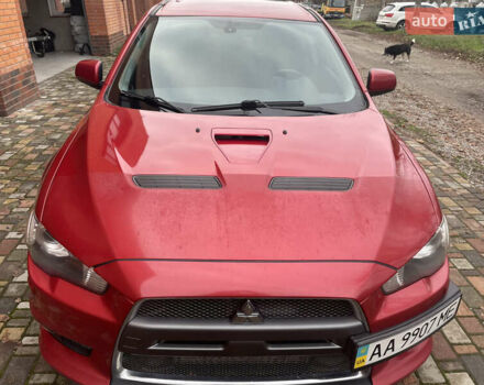 Красный Мицубиси Лансер Эволюшн, объемом двигателя 2 л и пробегом 110 тыс. км за 17000 $, фото 2 на Automoto.ua