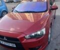 Красный Мицубиси Лансер Эволюшн, объемом двигателя 2 л и пробегом 259 тыс. км за 7400 $, фото 1 на Automoto.ua