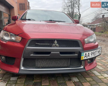 Красный Мицубиси Лансер Эволюшн, объемом двигателя 2 л и пробегом 110 тыс. км за 17000 $, фото 1 на Automoto.ua