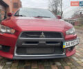 Красный Мицубиси Лансер Эволюшн, объемом двигателя 2 л и пробегом 110 тыс. км за 17000 $, фото 1 на Automoto.ua