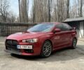 Червоний Міцубісі Лансер Еволюшн, об'ємом двигуна 2 л та пробігом 105 тис. км за 16700 $, фото 1 на Automoto.ua