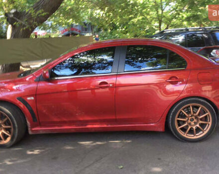 Красный Мицубиси Лансер Эволюшн, объемом двигателя 2 л и пробегом 115 тыс. км за 18000 $, фото 2 на Automoto.ua