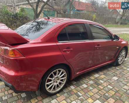 Красный Мицубиси Лансер Эволюшн, объемом двигателя 2 л и пробегом 110 тыс. км за 17000 $, фото 6 на Automoto.ua