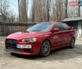 Красный Мицубиси Лансер Эволюшн, объемом двигателя 2 л и пробегом 105 тыс. км за 16700 $, фото 1 на Automoto.ua