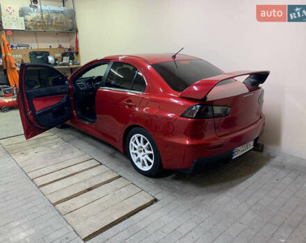 Красный Мицубиси Лансер Эволюшн, объемом двигателя 2 л и пробегом 115 тыс. км за 18000 $, фото 4 на Automoto.ua