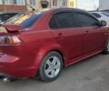 Красный Мицубиси Лансер Эволюшн, объемом двигателя 2 л и пробегом 259 тыс. км за 7400 $, фото 5 на Automoto.ua
