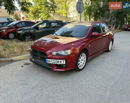 Красный Мицубиси Лансер Эволюшн, объемом двигателя 2 л и пробегом 115 тыс. км за 18000 $, фото 5 на Automoto.ua