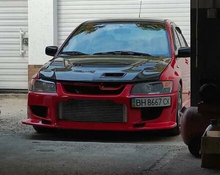 Красный Мицубиси Лансер Эволюшн, объемом двигателя 2 л и пробегом 30 тыс. км за 50000 $, фото 1 на Automoto.ua