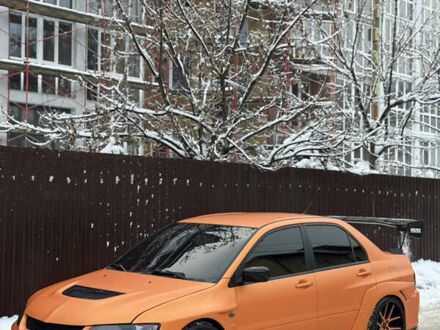 Красный Мицубиси Лансер Эволюшн, объемом двигателя 2 л и пробегом 125 тыс. км за 26000 $, фото 1 на Automoto.ua