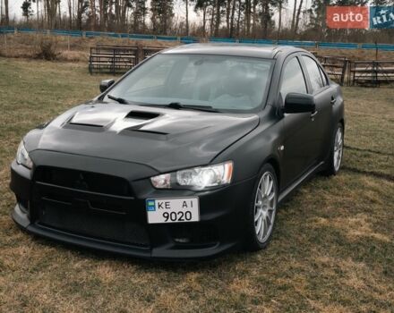 Червоний Міцубісі Лансер Еволюшн, об'ємом двигуна 2 л та пробігом 155 тис. км за 21000 $, фото 1 на Automoto.ua