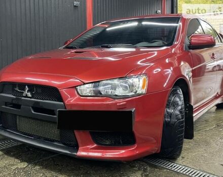 Червоний Міцубісі Лансер Еволюшн, об'ємом двигуна 2 л та пробігом 56 тис. км за 29000 $, фото 1 на Automoto.ua