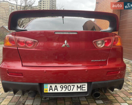 Красный Мицубиси Лансер Эволюшн, объемом двигателя 2 л и пробегом 110 тыс. км за 17000 $, фото 1 на Automoto.ua