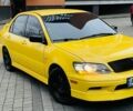 Жовтий Міцубісі Лансер Еволюшн, об'ємом двигуна 2 л та пробігом 160 тис. км за 3999 $, фото 2 на Automoto.ua
