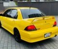 Жовтий Міцубісі Лансер Еволюшн, об'ємом двигуна 2 л та пробігом 160 тис. км за 3999 $, фото 7 на Automoto.ua