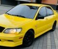 Жовтий Міцубісі Лансер Еволюшн, об'ємом двигуна 2 л та пробігом 160 тис. км за 3999 $, фото 1 на Automoto.ua