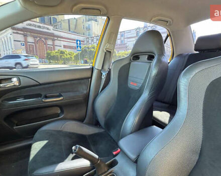 Жовтий Міцубісі Лансер Еволюшн, об'ємом двигуна 2 л та пробігом 124 тис. км за 32000 $, фото 15 на Automoto.ua