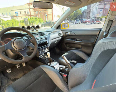 Жовтий Міцубісі Лансер Еволюшн, об'ємом двигуна 2 л та пробігом 124 тис. км за 32000 $, фото 13 на Automoto.ua