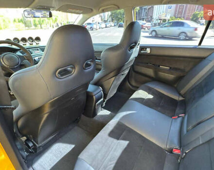 Жовтий Міцубісі Лансер Еволюшн, об'ємом двигуна 2 л та пробігом 124 тис. км за 32000 $, фото 23 на Automoto.ua