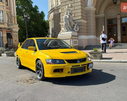Жовтий Міцубісі Лансер Еволюшн, об'ємом двигуна 2 л та пробігом 124 тис. км за 32000 $, фото 18 на Automoto.ua